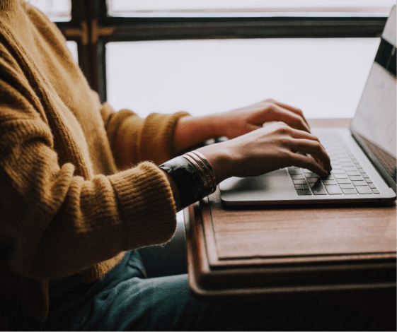 a person typing on a laptop