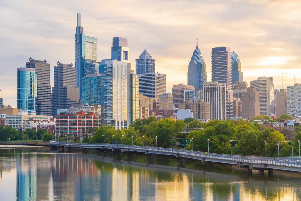 A breathtaking sunset over Philadelphia's downtown skyline, showcasing the vibrant cityscape of Pennsylvania.