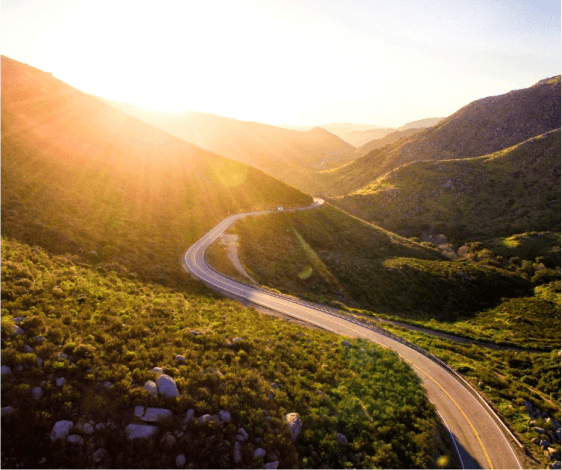 a winding road through a valley