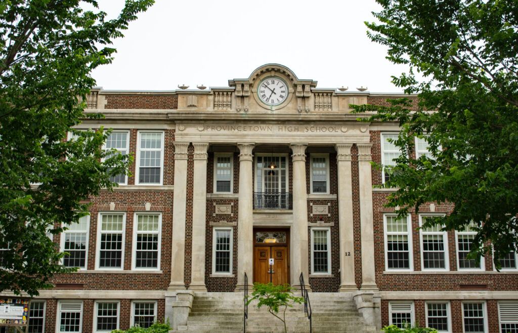 a brick building with a clock on the front