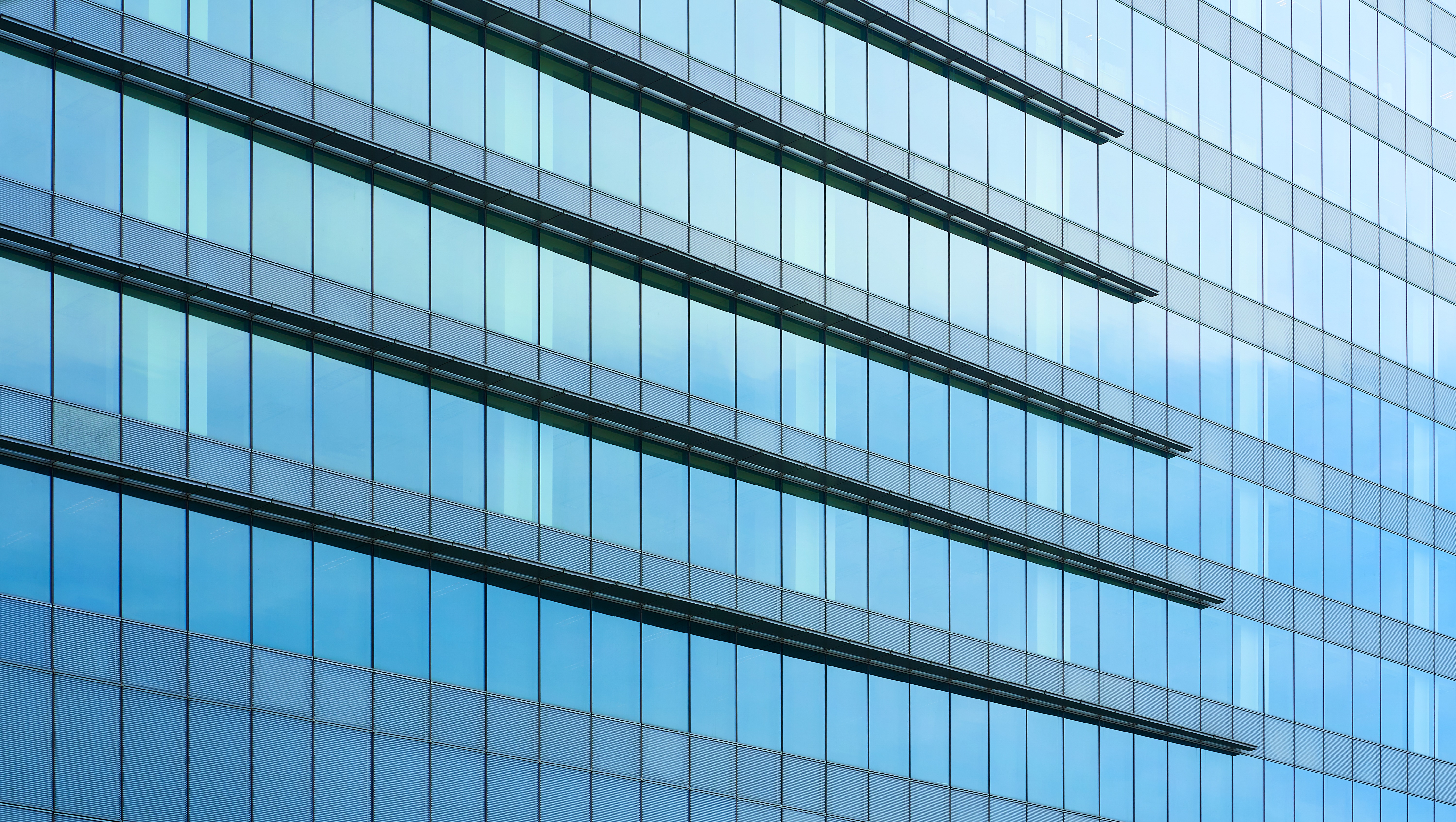 Glass windows of high rise commercial skyscraper building